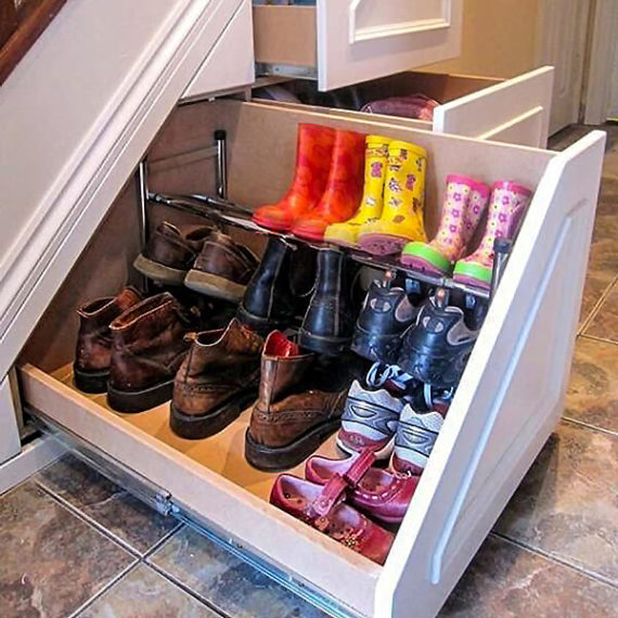 Under staircase storage solution for shoes and boots