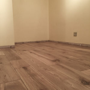 Wide-wood-flooring-laid-and-ready-for-the-skirting